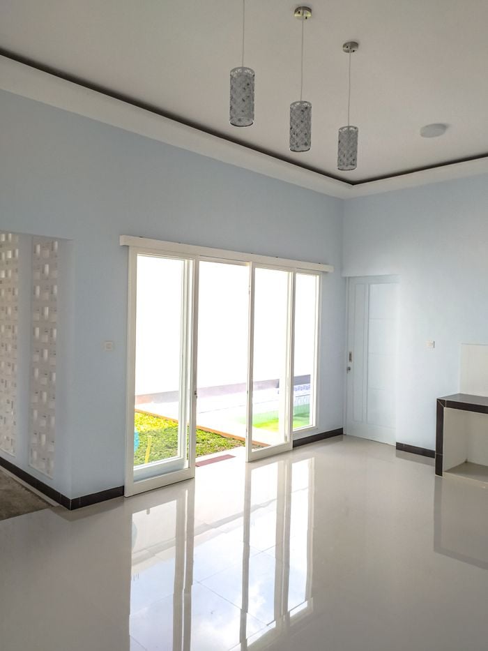Services Minimalist interior of light spacious hall of modern office with sliding doors and shiny floor on sunny day